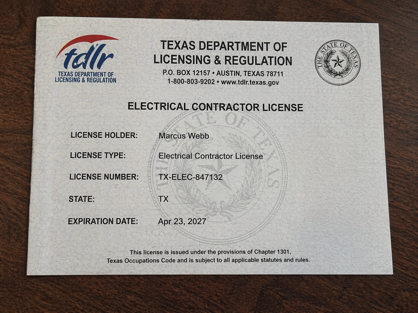 Camera viewfinder aimed at a contractor license card